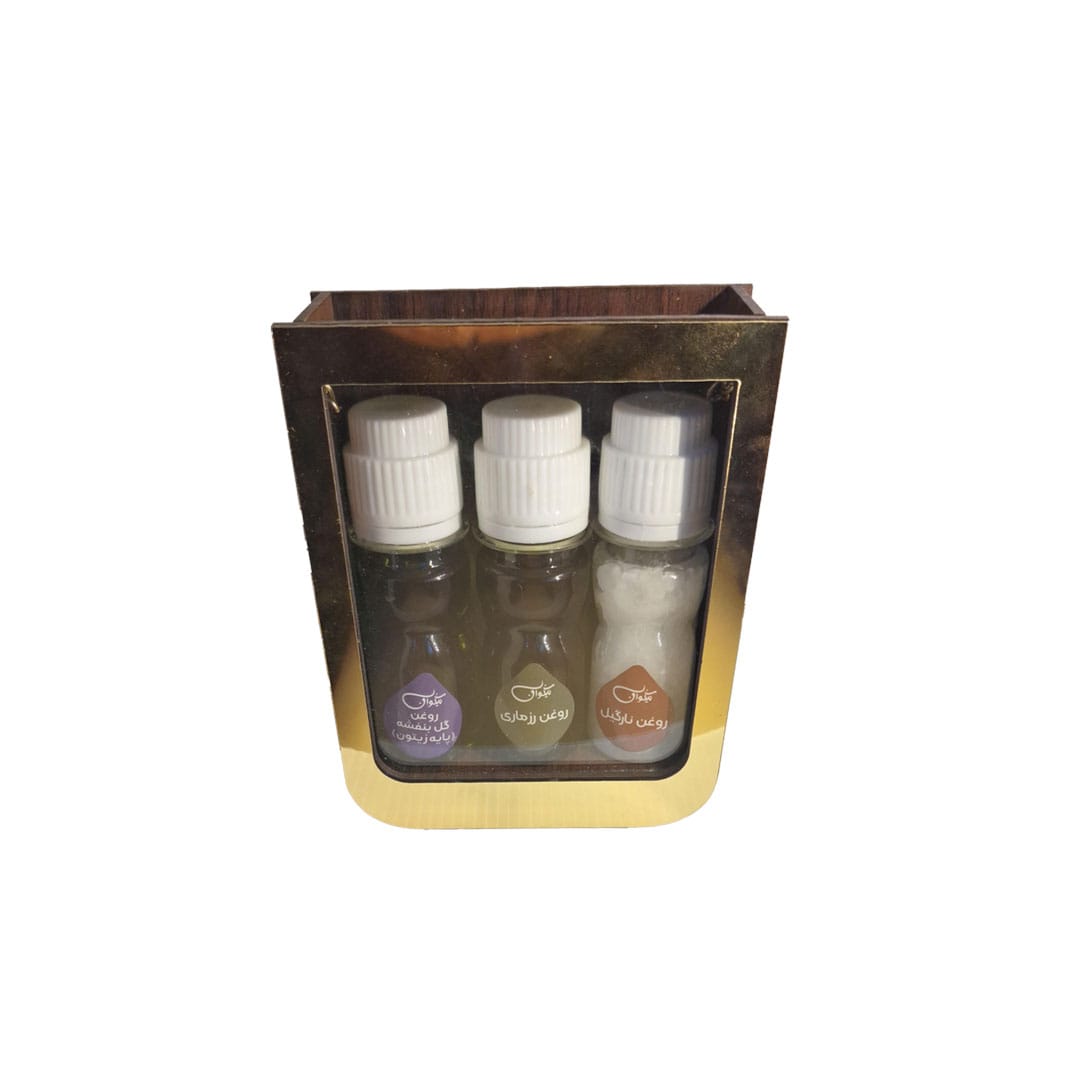 بسته هدیه رفع شوره سر Anti-Dandruff نیکوان حاوی روغن نارگیل، روغن رزماری و روغن گل بنفشه پایه زیتون در جعبه طلایی و شفاف.