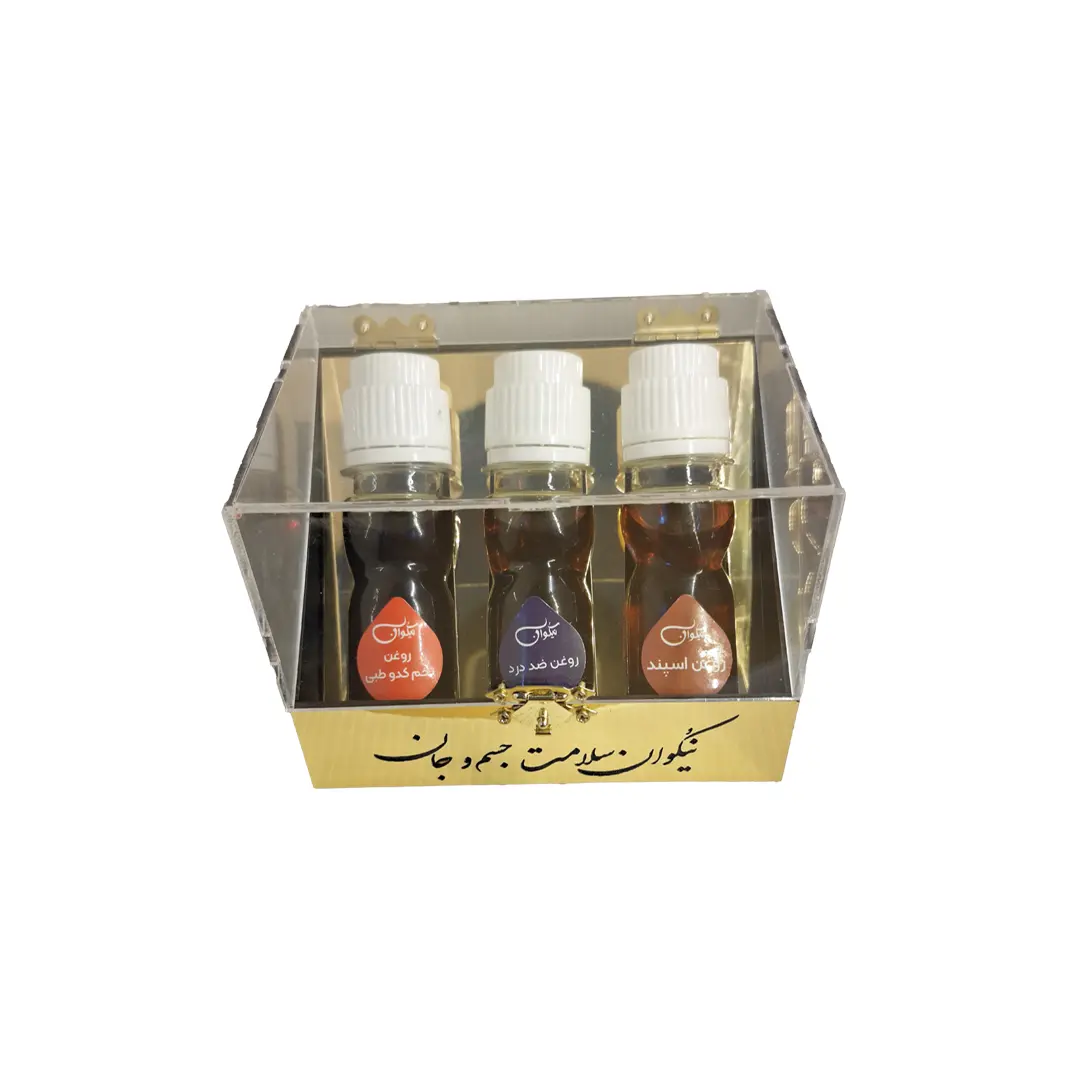 پک پدربزرگ و مادربزرگ نیکوان شامل روغن اسپند، روغن ضد درد و روغن تخم کدو، در محیطی سنتی با کدو حلوایی و دانه‌های اسپند.